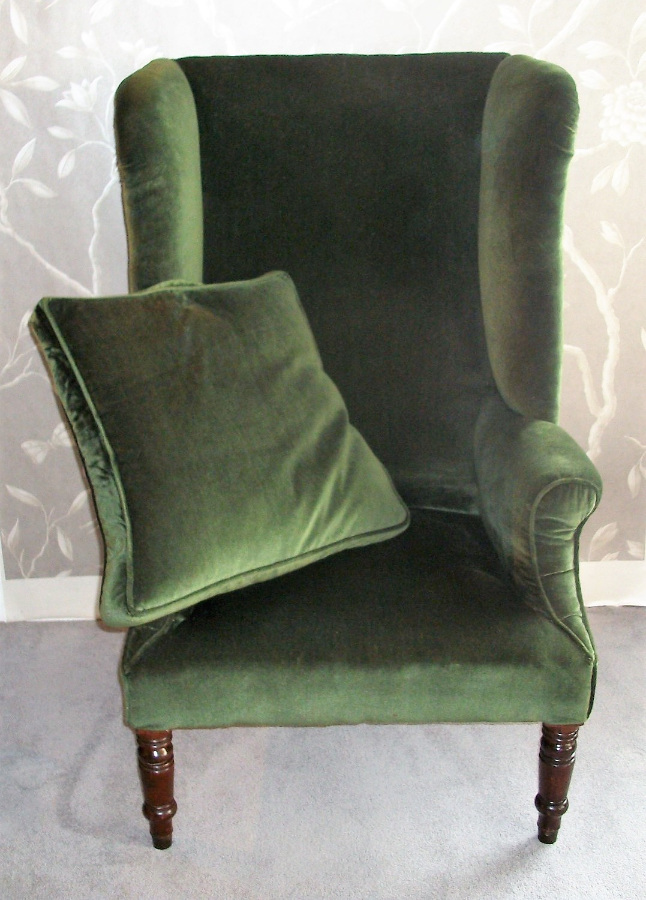 large antique wing back armchair